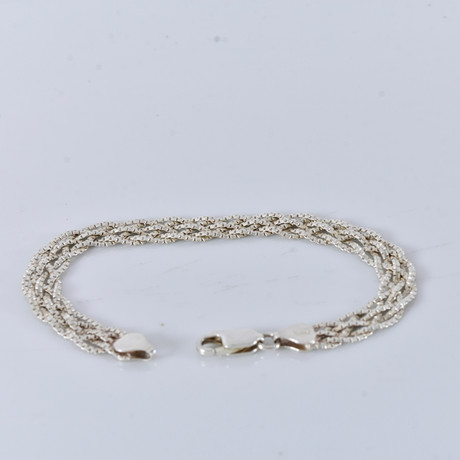 ARMBAND, flätad modell, sterlingsilver. på auktion hos Halmstads Auktionskammare