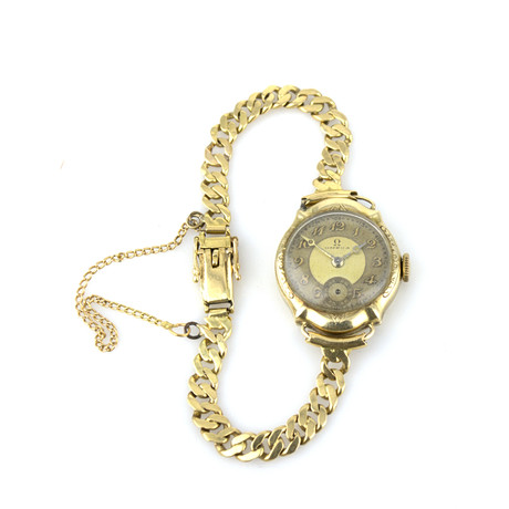 OMEGA. Armbandsur och länk, guld 14k, manuell, 1930-40 tal. på auktion hos Höganäs Auktionsverk