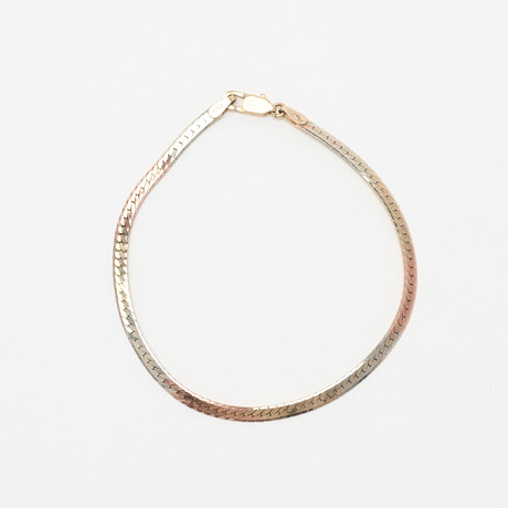 ARMBAND, 10K trefärgat guld, Italien. på auktion hos Uppsala Auktionskammare