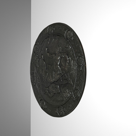 J&C G. BOLINDER. TILLSKRIVEN. Sköldformat relief av svartmålat gjutjärn 'Lokes straff' ca 1900.