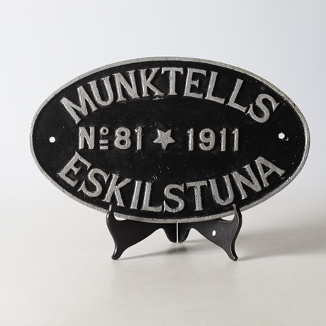 SKYLT, gjutjärn, Munktells, Eskilstuna. på auktion hos Gomér & Andersson Nyköping