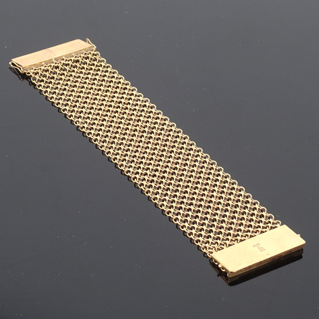 ARMBAND, 18k guld, 14 radig x-länk, Clareus Guldsmeds Ab, Stockholm. 19/2000-tal. på auktion hos Stadsauktion Sundsvall