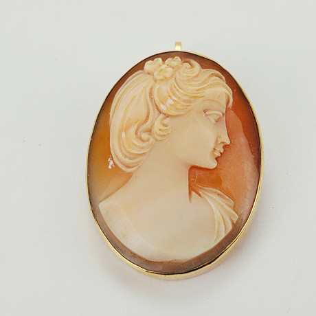 BROSCH/HÄNGE, guld, 18K, total vikt ca. 6,6 gram. på auktion hos Auktionshuset Thörner & Ek