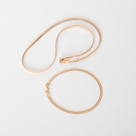 SMYCKESET, 2 delar, 18K guld, halsband och armband. på auktion hos Auktionsverket Engelholm