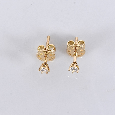 ENSTENSÖRHÄNGEN, 0,17ct, 18K. på auktion hos Halmstads Auktionskammare