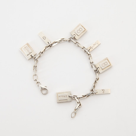 EFVA ATTLING. f 1952. Armband med berlocker, "Hope & Life", sterlingsilver. på auktion hos Auktionsverket Engelholm