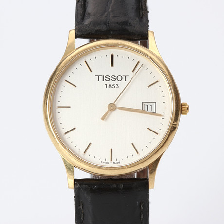 TISSOT, ARMBANDSUR. Boett i 18k guld, quartz. på auktion hos Skånes Auktionsverk