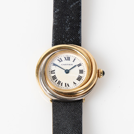 CARTIER, damarmbandsur 'Trinity', 18K guld. Diam 27 mm. på auktion hos Stockholms Auktionsverk Helsingborg