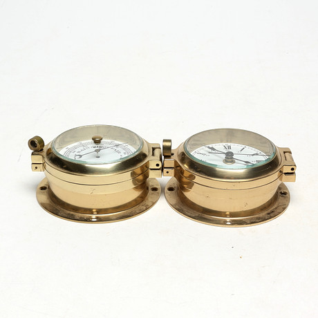 VÄGGUR och BAROMETER, nautisk typ, metall/glas. på auktion hos Kalmar Auktionsverk