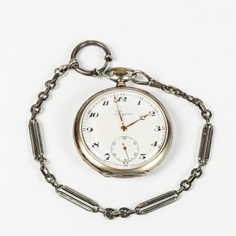 LONGINES fickur, boett och kedja i silver, 1900-talets första hälft. på auktion hos Karlstad Hammarö Auktionsverk