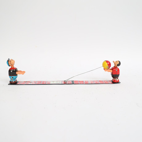 LINEMAR, Japan, 1950-tal. Plåtleksak, litograferad, uppdragbar. Popeye & Olive Oyl Ball Toss Toy. på auktion hos Falun Auktionsbyrå