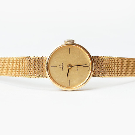 ARMBANDSUR, Omega, De Ville, 18k guld i boett och länk, quartz, totalvikt ca 27,6 gram. på auktion hos Göteborgs Auktionsverk
