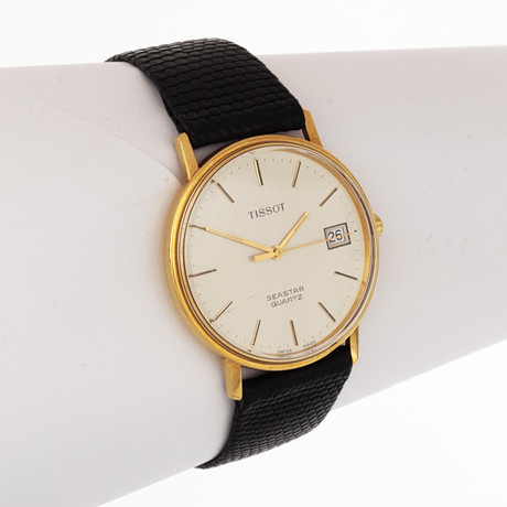 ARMBANDSUR, boett guld 18k, Tissot Seastar Quartz. på auktion hos Växjö Auktionskammare