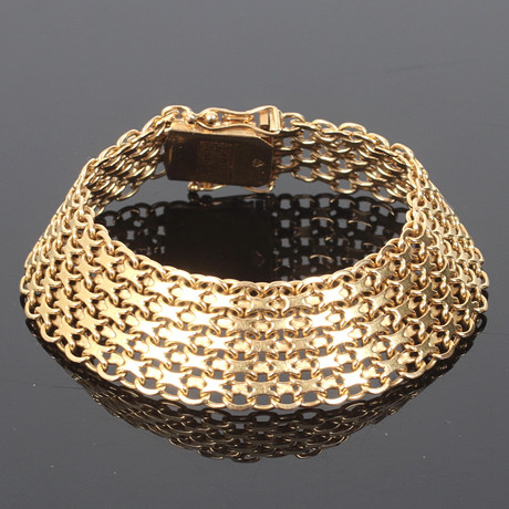 ARMBAND, 18k guld, treradigt, x-länk. på auktion hos Stadsauktion Sundsvall
