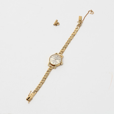 MOVADO, Armbandsur, guld 18K. på auktion hos Uppsala Auktionskammare