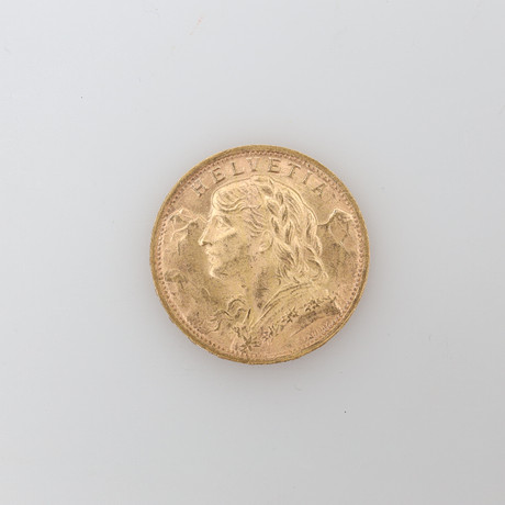GULDMYNT ,Helvetia 20Fr 1935, 21,6K bruttovikt ca 6,4 gram. på auktion hos Borås Auktionshall