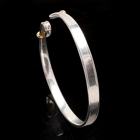 VIVIANNA TORUN BÜLOW-HÜBE. Armring, sterlingsilver med 18 k gulddetaljer, Georg Jensen. på auktion hos Crafoord Auktioner Malmö