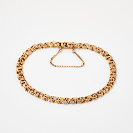 ARMBAND, 18 k guld, bismarcklänk, svenska stämplar. på auktion hos Stockholms Auktionsverk Sickla
