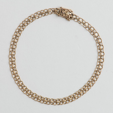 ARMLÄNK, x-länk, 18 k guld, 5,17 gram. på auktion hos Auktionshuset Thelin & Johansson