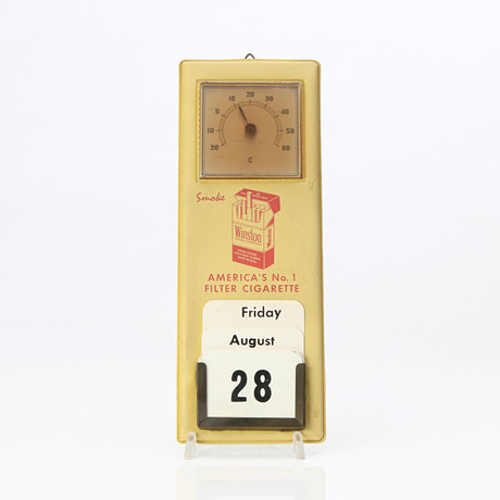 WINSTON, REKLAMSKYLT. Galon, med kalender och termometer. 1900-talets mitt. på auktion hos Skånes Auktionsverk