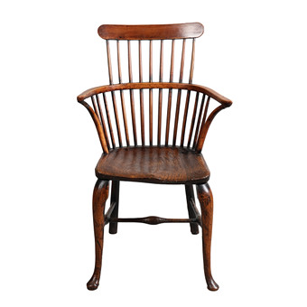 A GEORGE III YEW AND ELM COMB BACK ARMCHAIR.