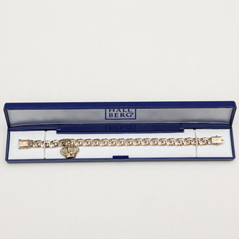 ARMBAND, 18 karat guld, bismarck med berlock, totalvikt ca 19,6 gram.
