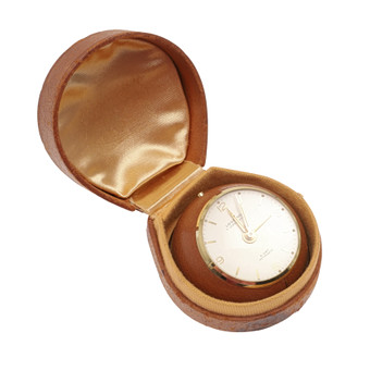 A LOOPING 8 DAY TRAVEL ALARM CLOCK.