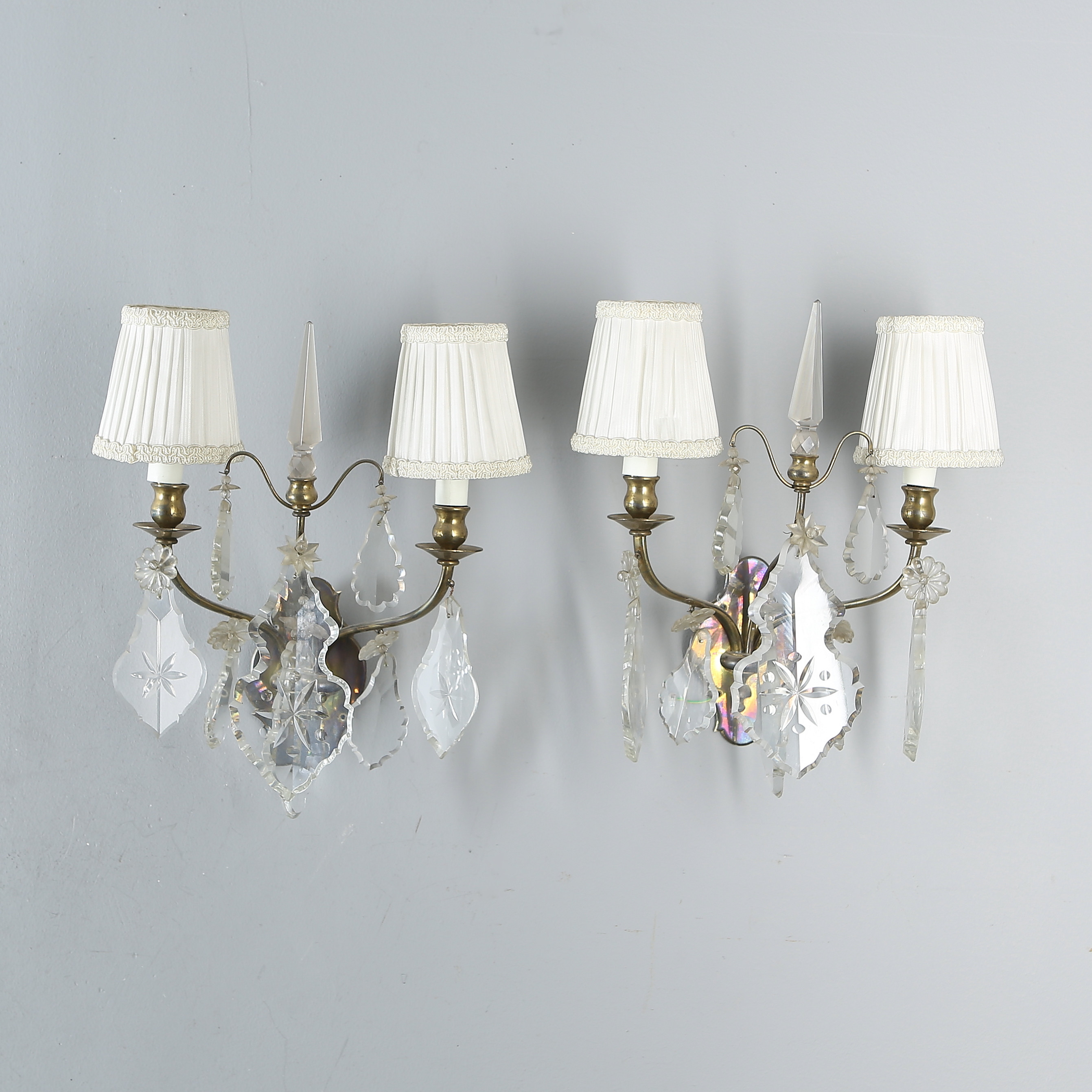 WALL LAMPS, a pair, brass, hung with prisms, first half of WALL LAMPS, a pair, brass, hung with prisms, first half of