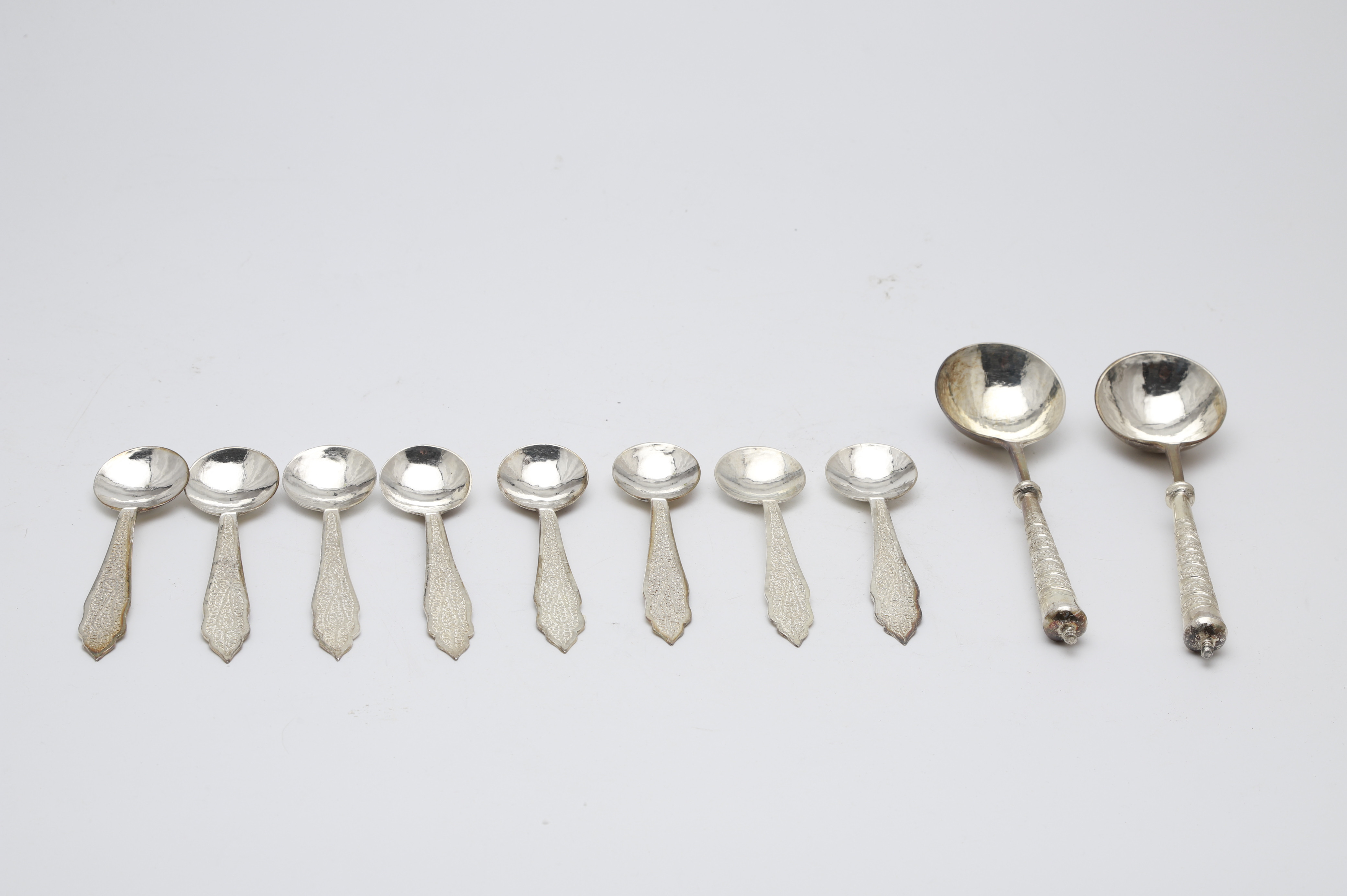 Images for 2029829. Set of eight spoons and set of two Indian serving spoons in silver, 20th