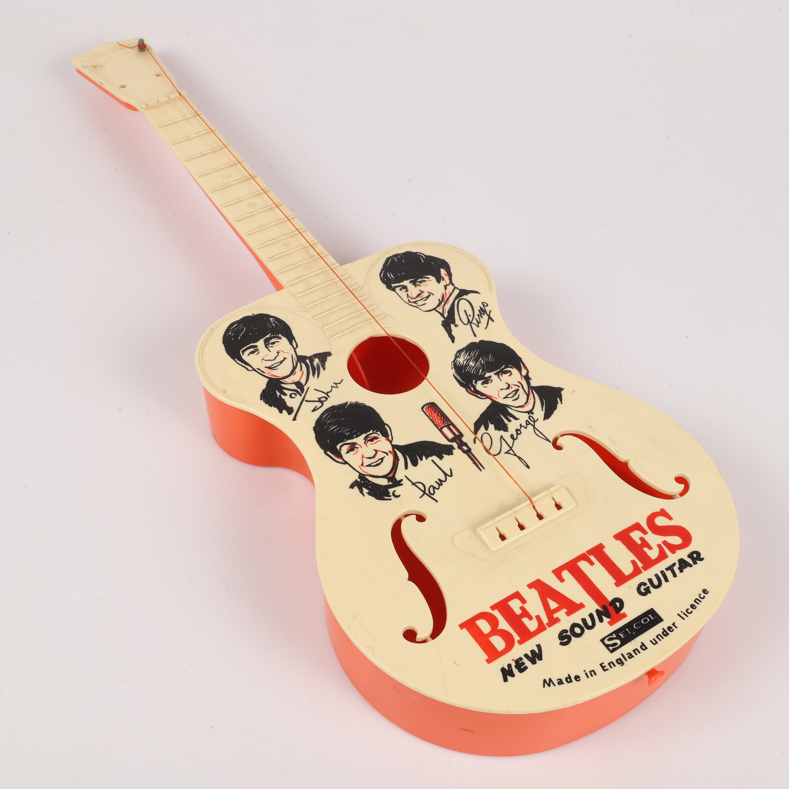 A Selcol Beatles New Sound Guitar plastic toy guitar (playwear and faults