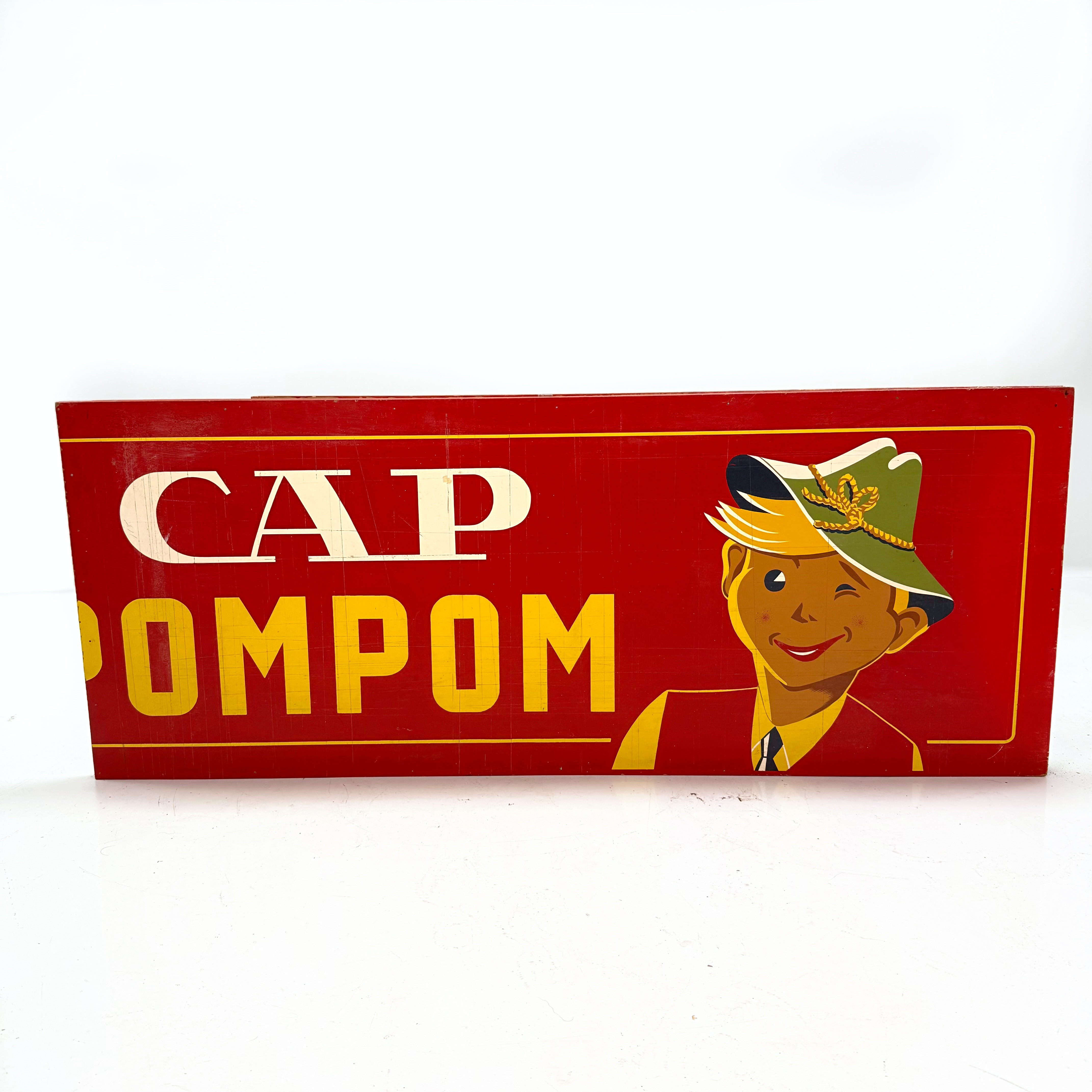 REKLAMSKYLT - CAP POMPOM, trä, playwood 1900 talets första del.