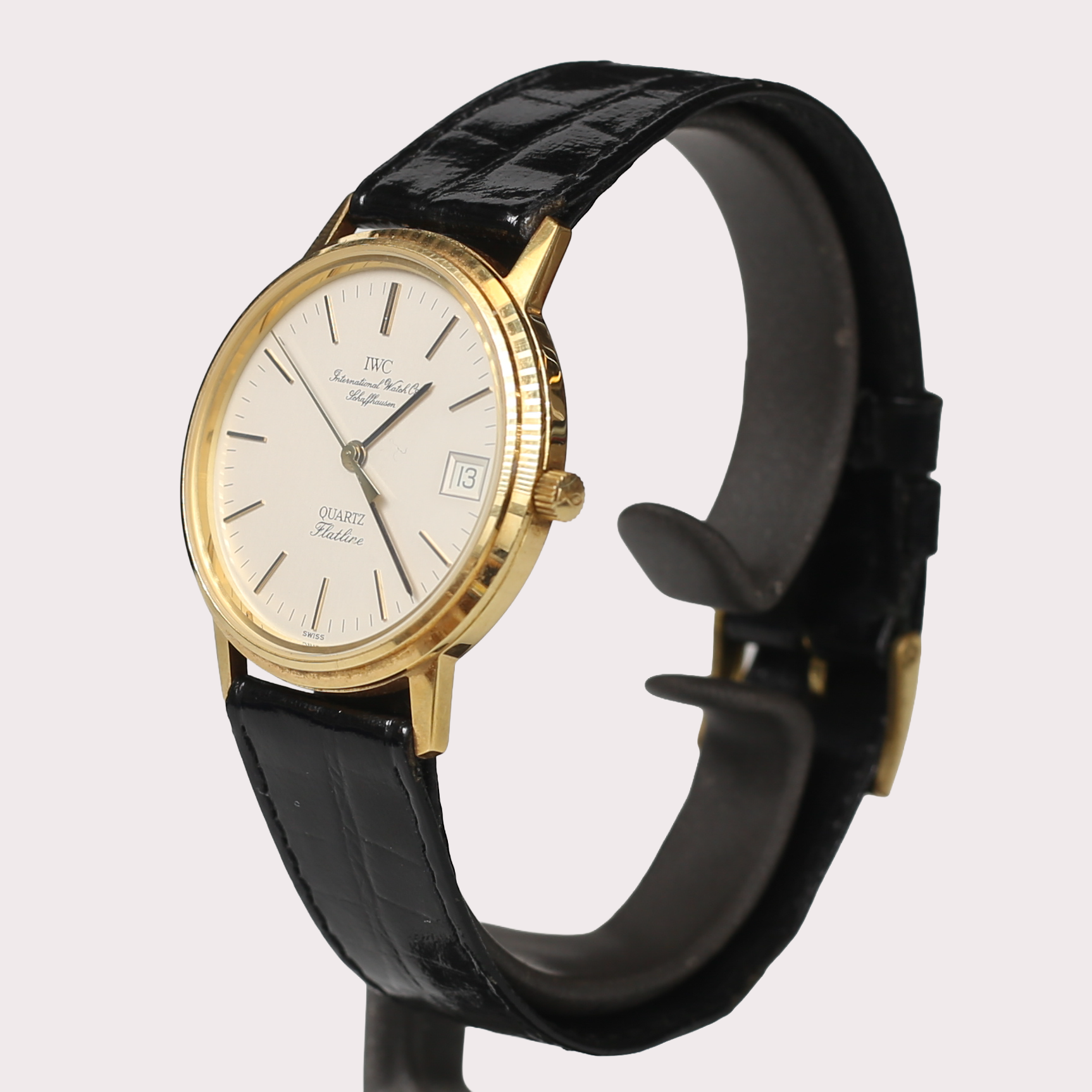 ARMBANDSUR IWC Flatline, 18k guld med original läderband, IWC originaletui. IWC skrifter. 1900-talets sista fjärdedel.