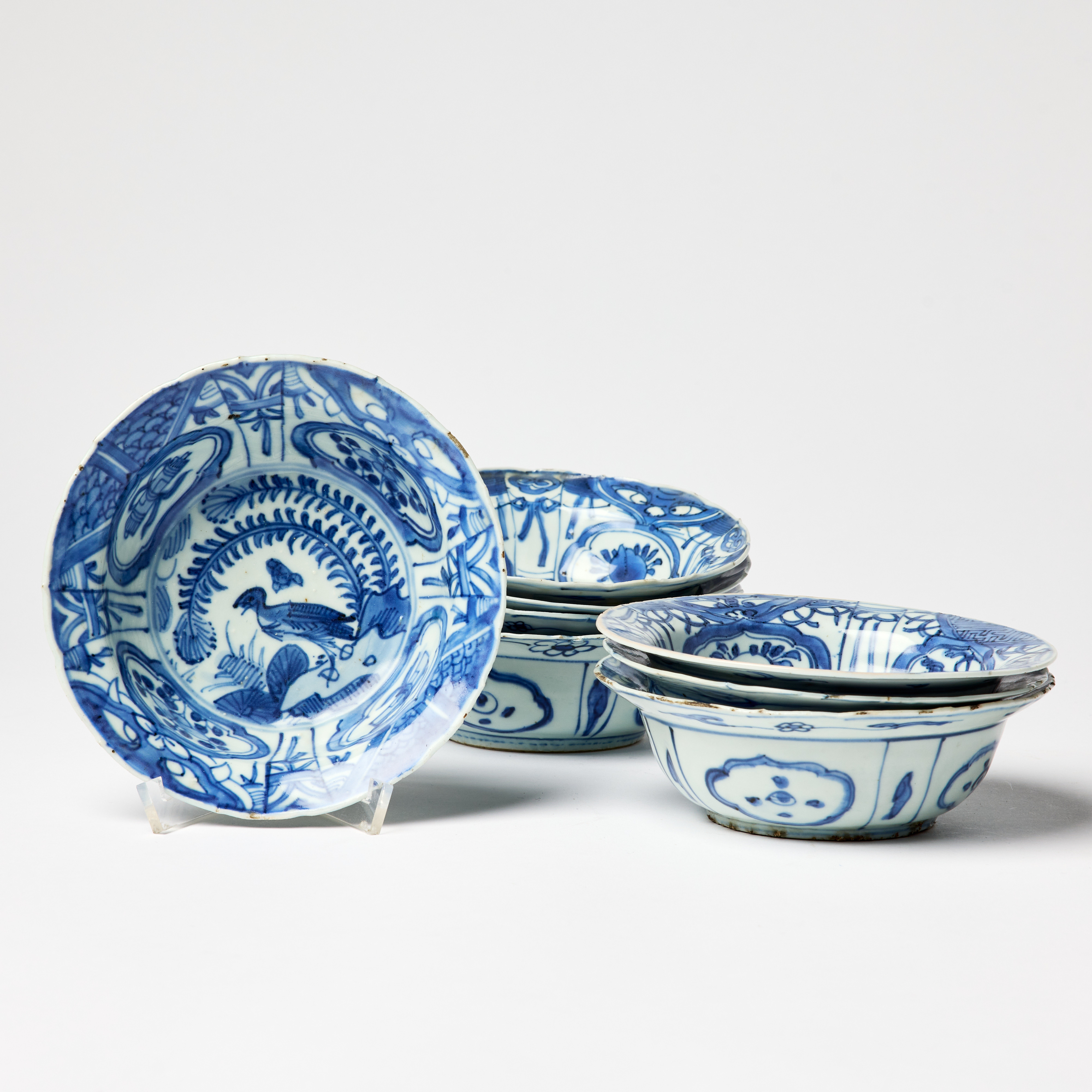 Eight Chinese Blue and White Moulded 'Kraak' Dessert Bowls.