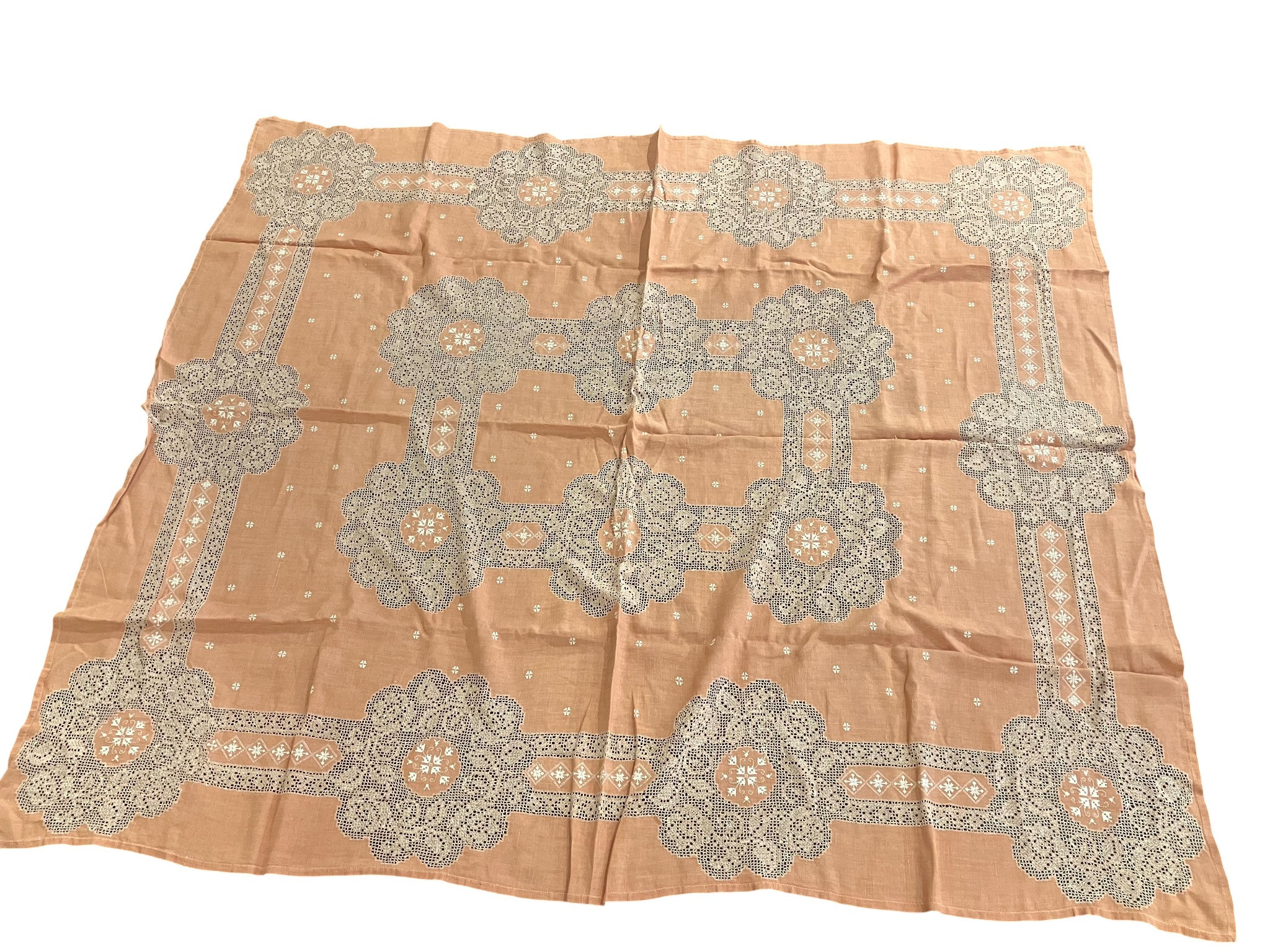 Set of salmon-coloured table linens with hemstitched borders and white trimmings, second half of the 20th Century.