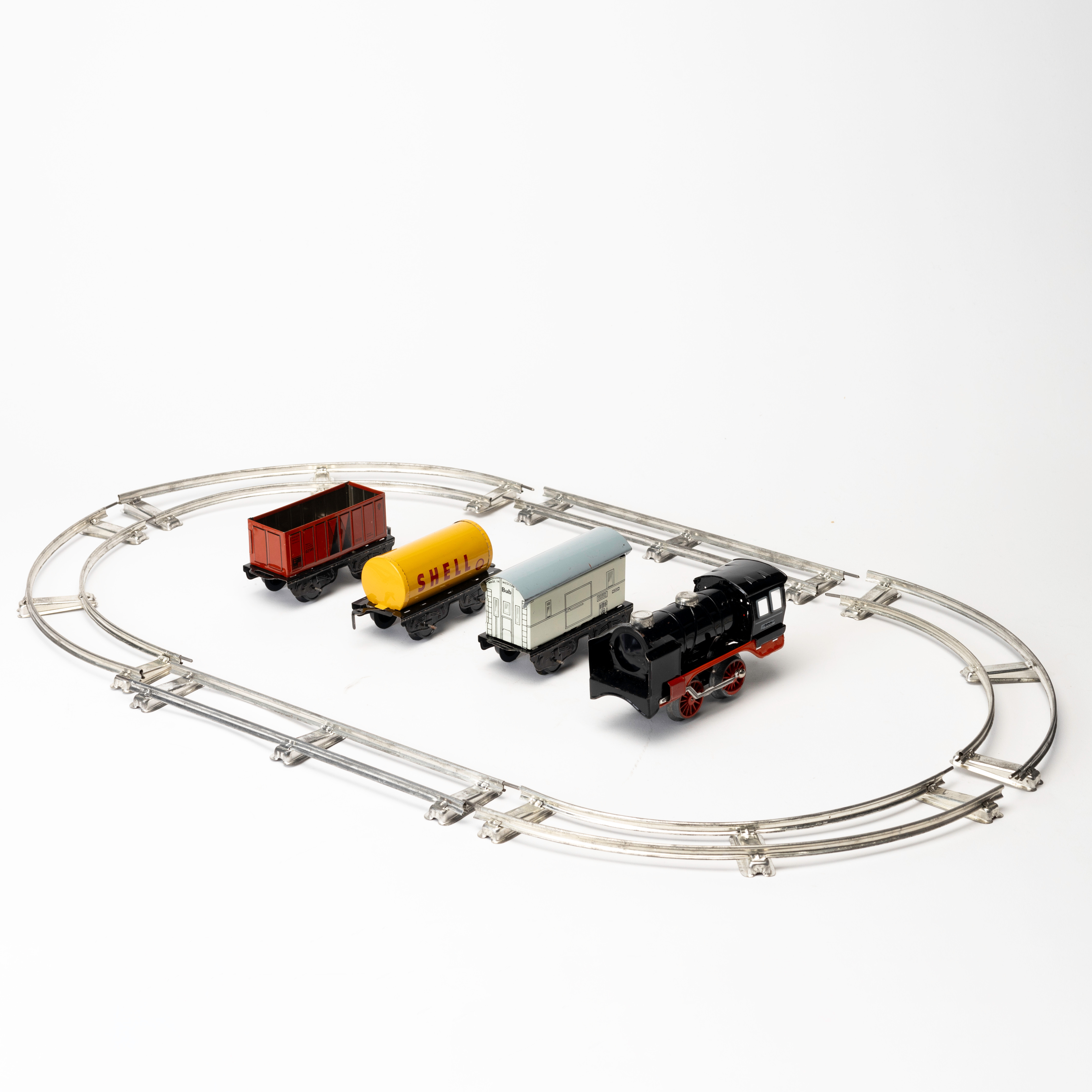 KARL BUB Tåglok, mekanisk, med 3 vagnar samt räls 6 delar, Västtyskland.