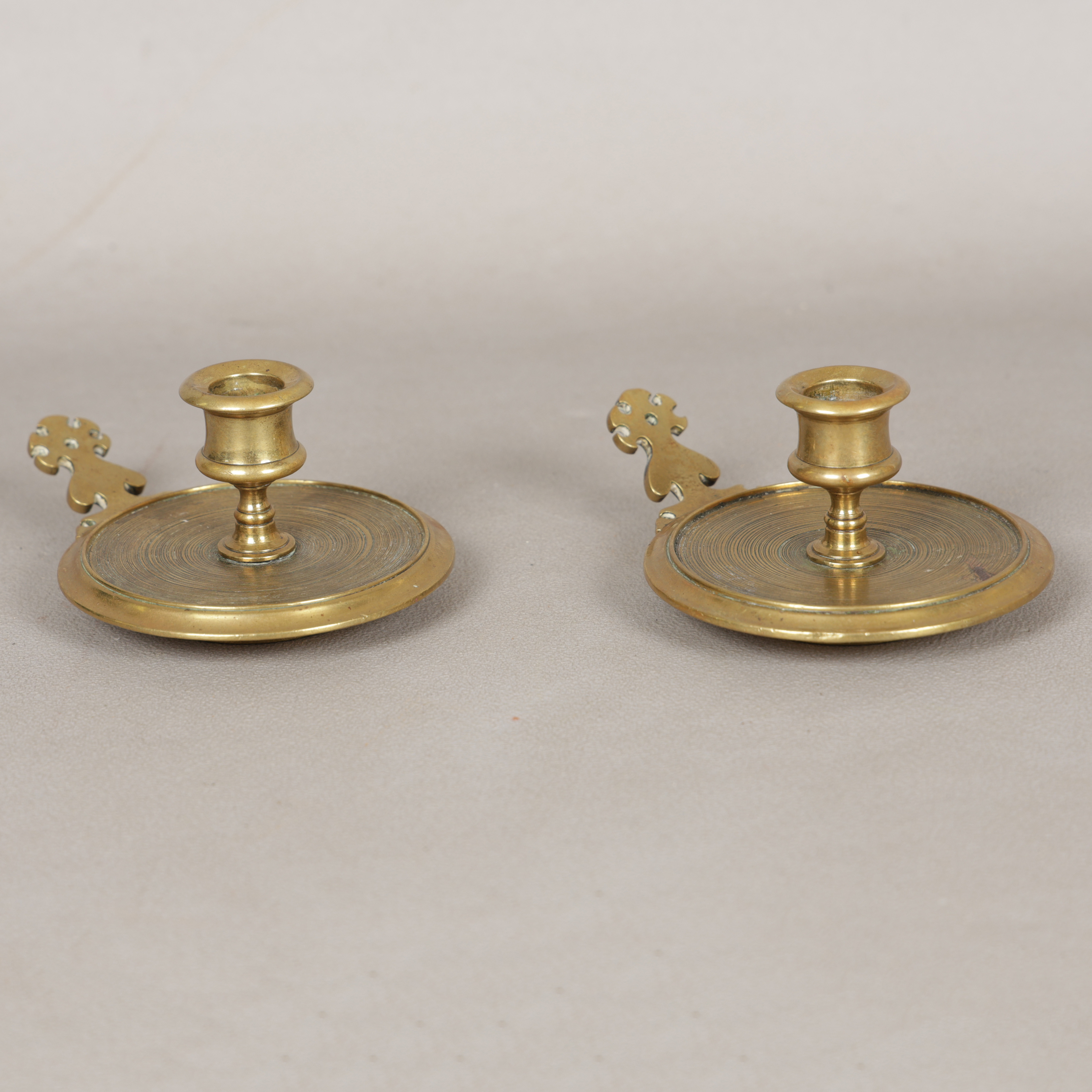 A PAIR OF LATE 17TH CENTURY STYLE BRASS CHAMBERSTICKS (2).