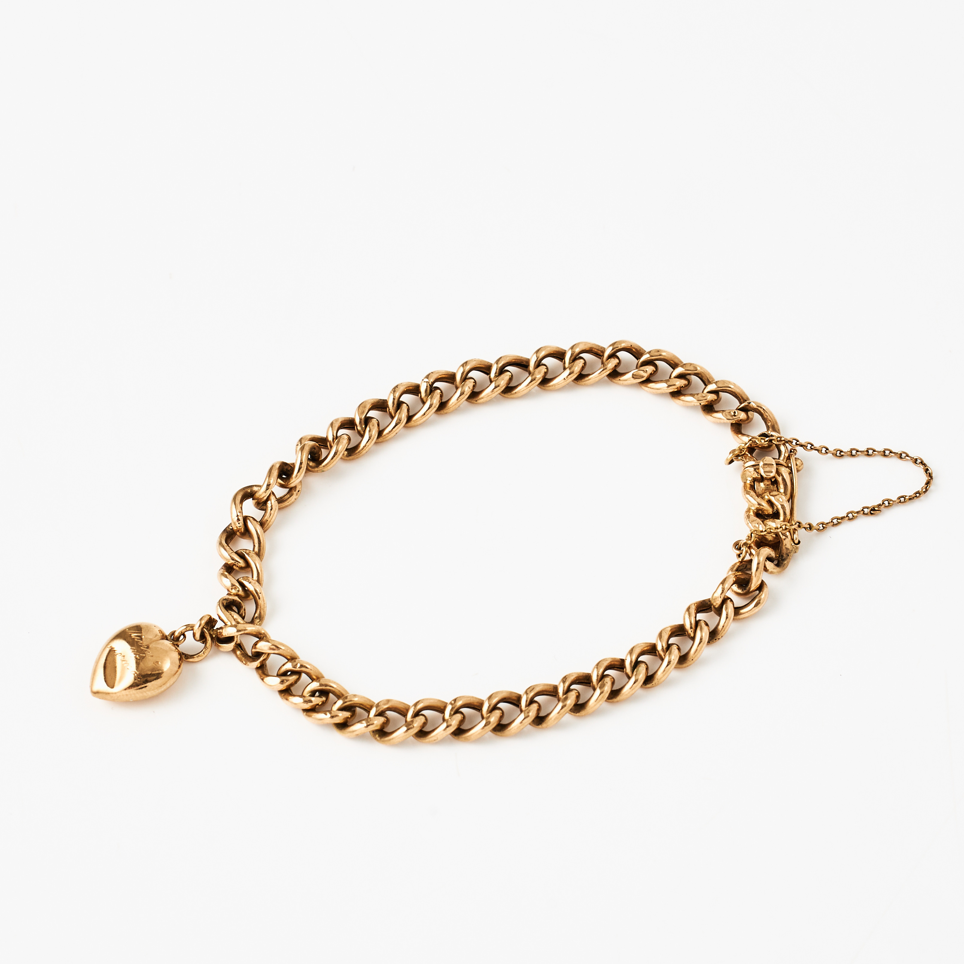 ARMBAND MED BERLOCK, 18 k guld, pansarlänk, i form av ett hjärta, svenska kontrollstämplar.