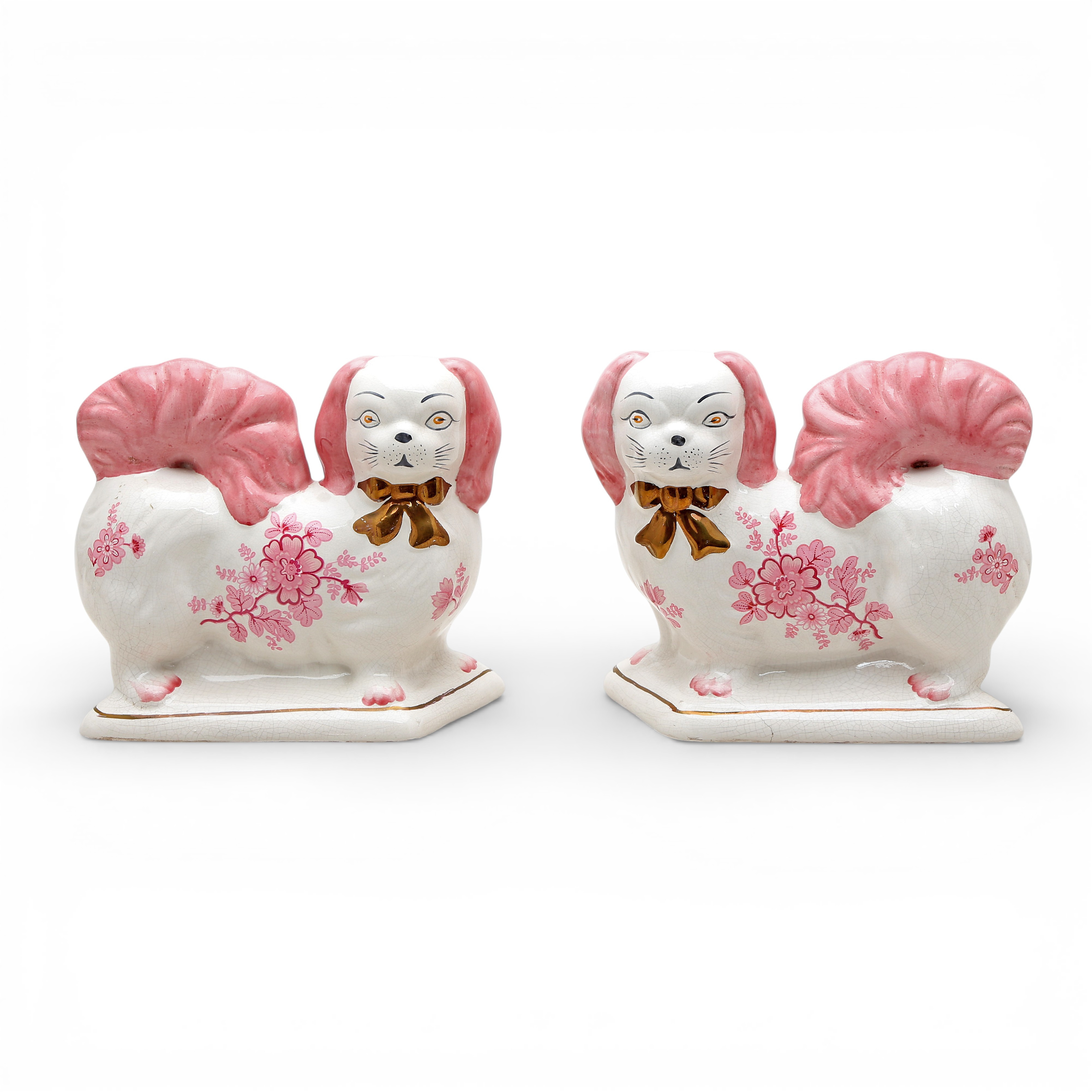 “Spaniel dogs”, pair of Staffordshire earthenware figures, 20th Century.