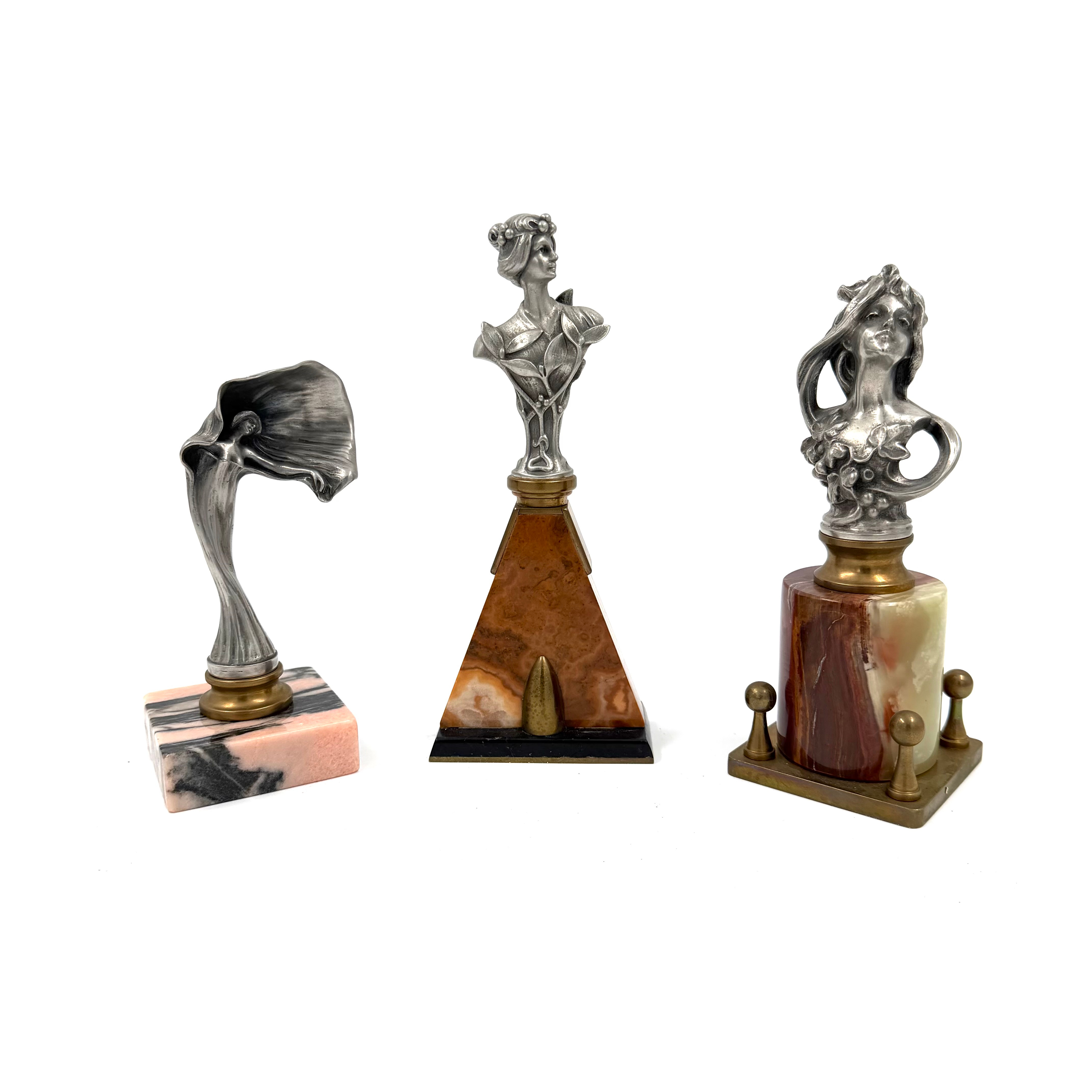 SKULPTURER, 3 st, art nouveau stil, 1900-tal, metall, socklar av sten.