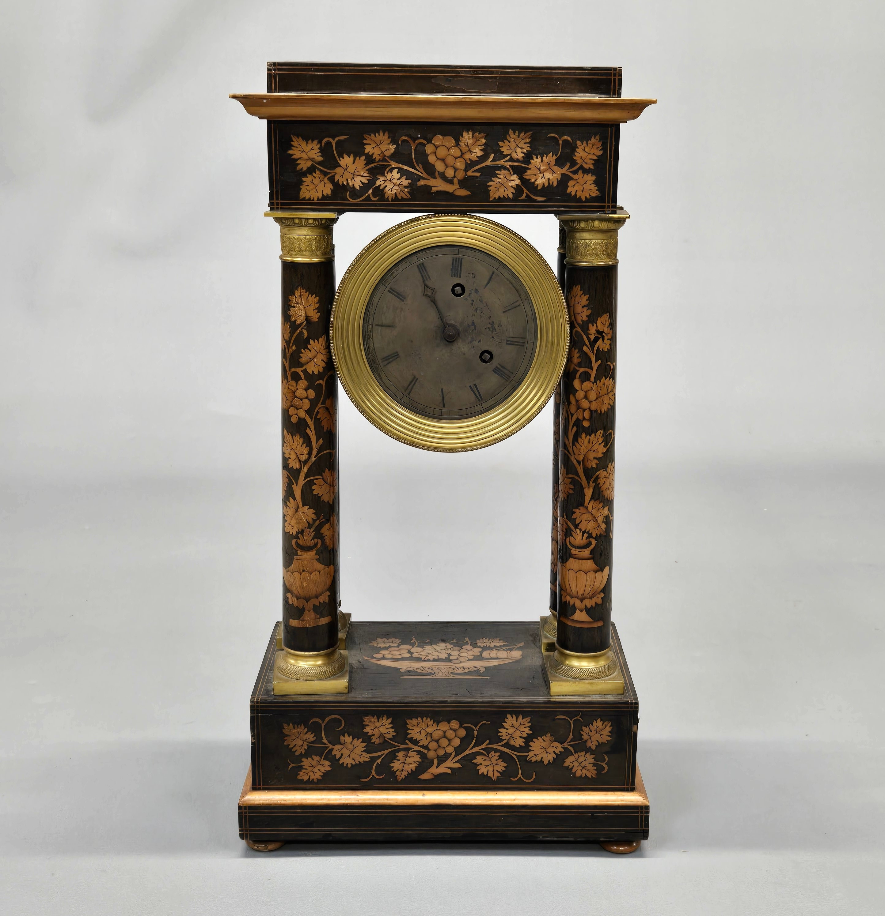 A WOODEN INLAID MANTLE CLOCK.