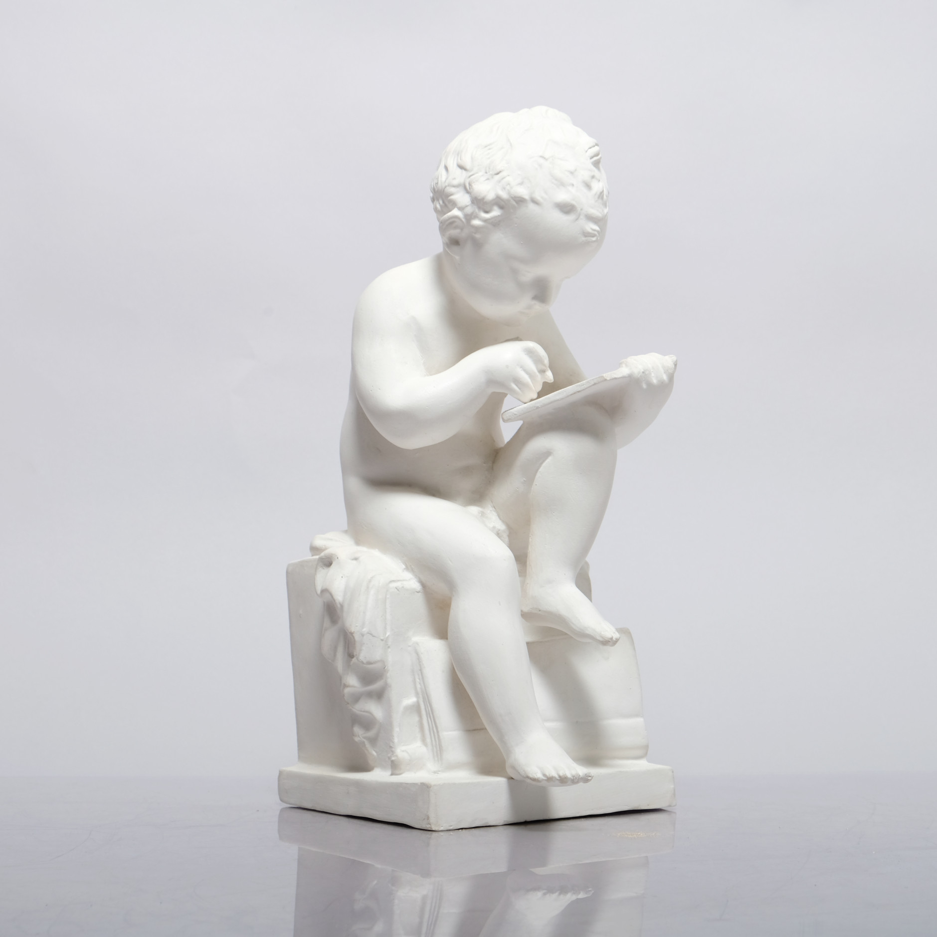 GUNVOR OLIN-GRÖNQVIST. Skulptur, läsande pojke, 1900-talets andra hälft.