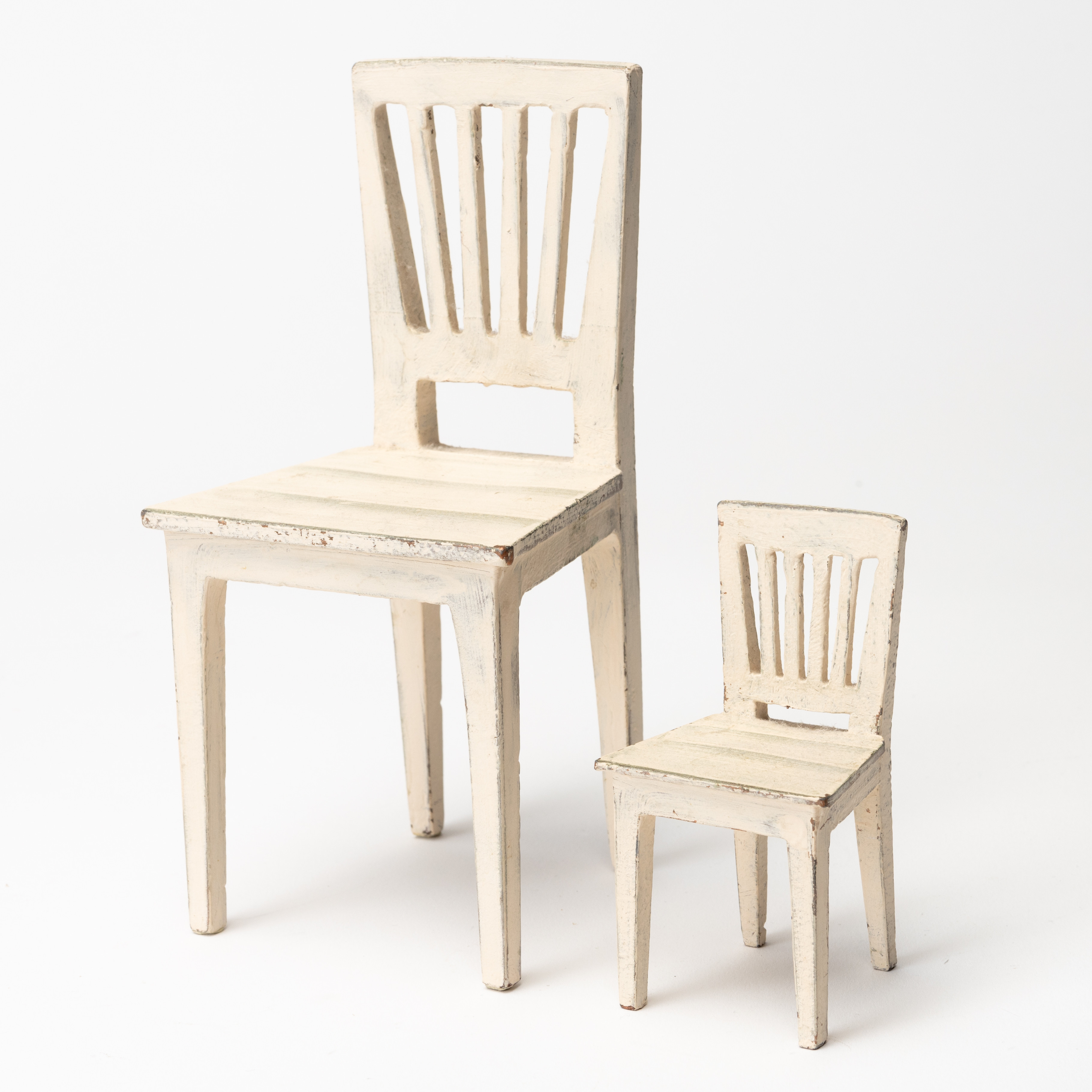 HANS EDBLAD. Bokstöd, 2 st, metall, i form av stolar, en stämplad, Fafner Singö, 1990-tal.