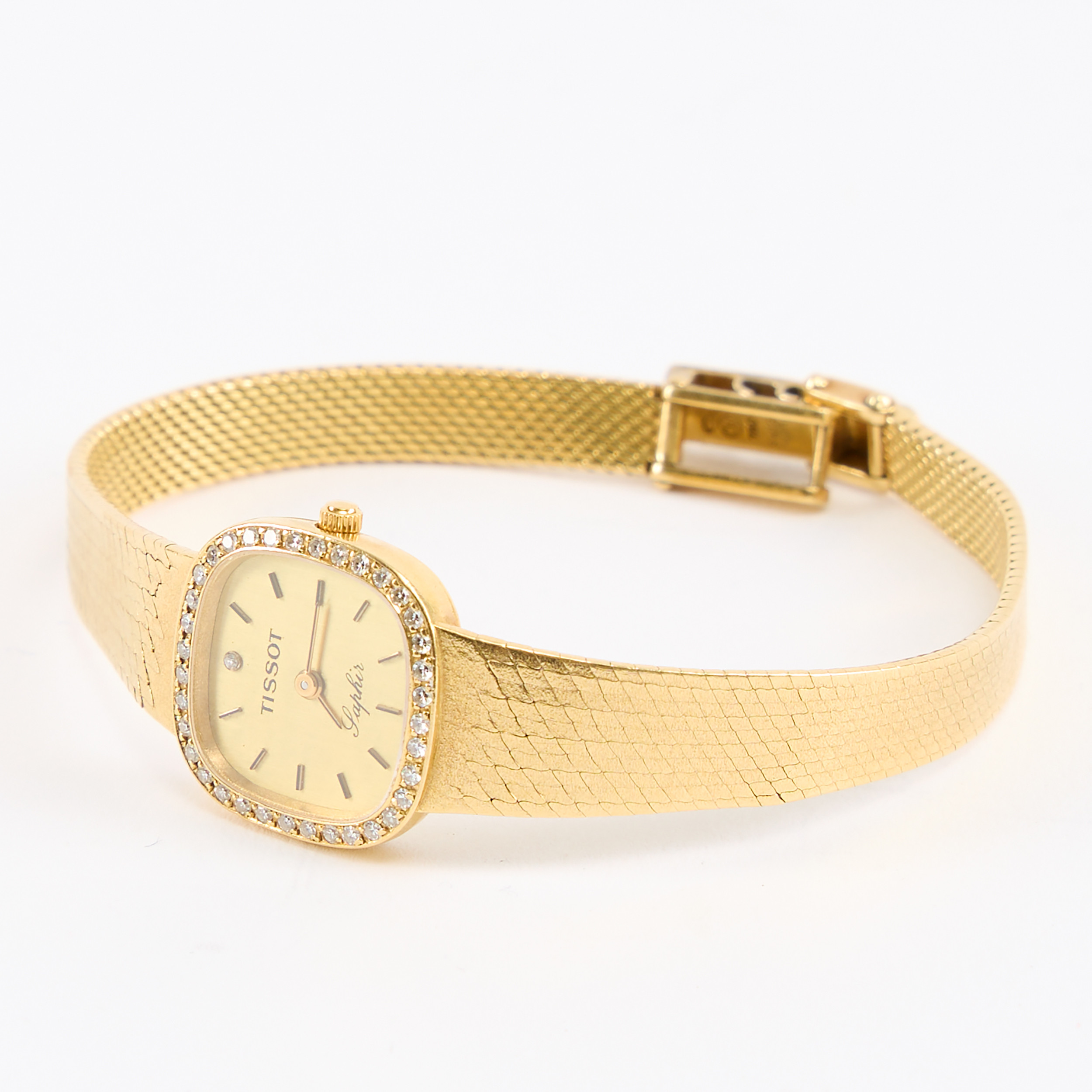 TISSOT. Damarmbandsur, Saphir, guld 18K.