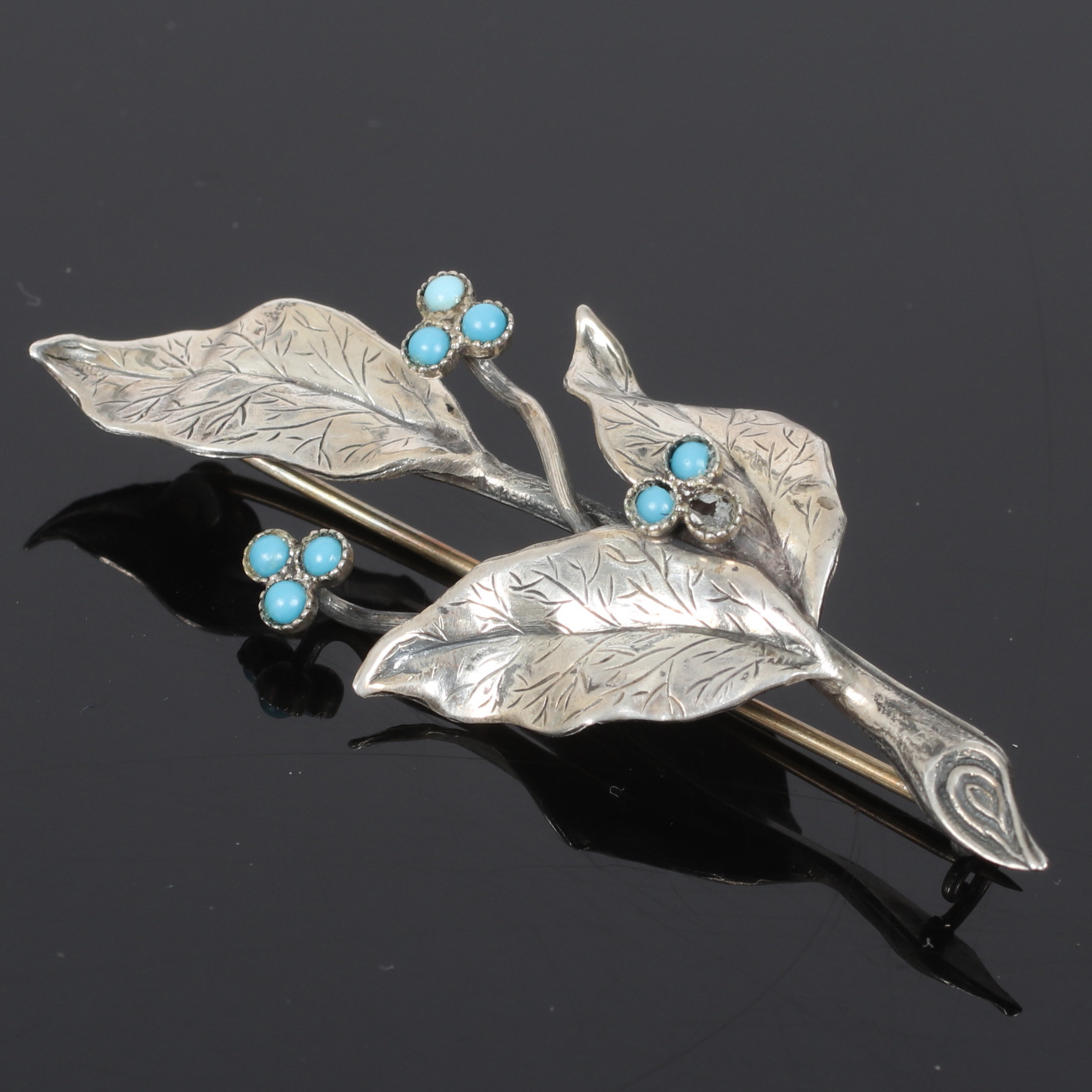 BROSCH, silver, med turkoser och blad, U P A Pinco Förening, Stockholm. 1953.