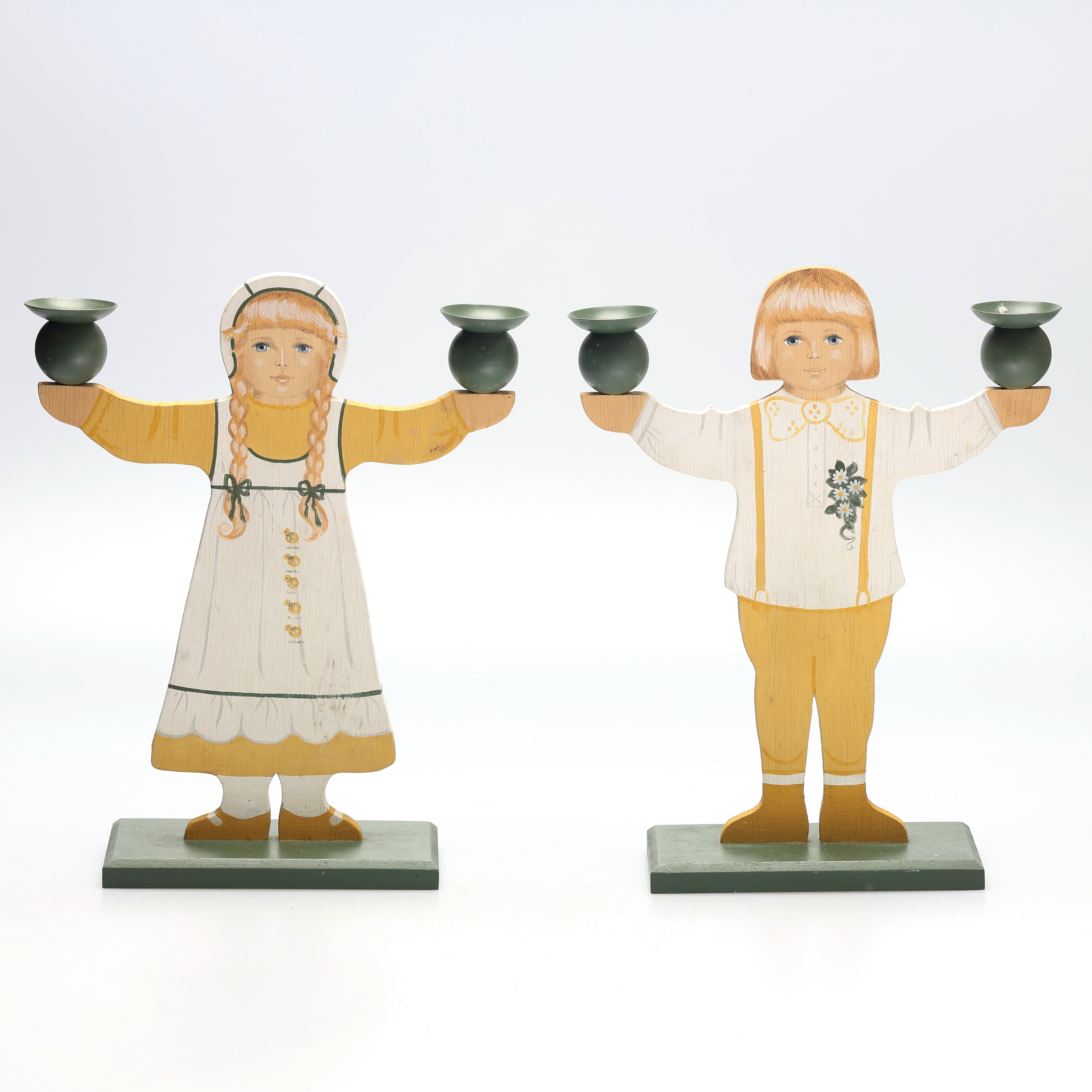 BIRGITTA HEDLUND. Ljusstakar, ett par, bemålat trä, i form av pojke och flicka, signerade.