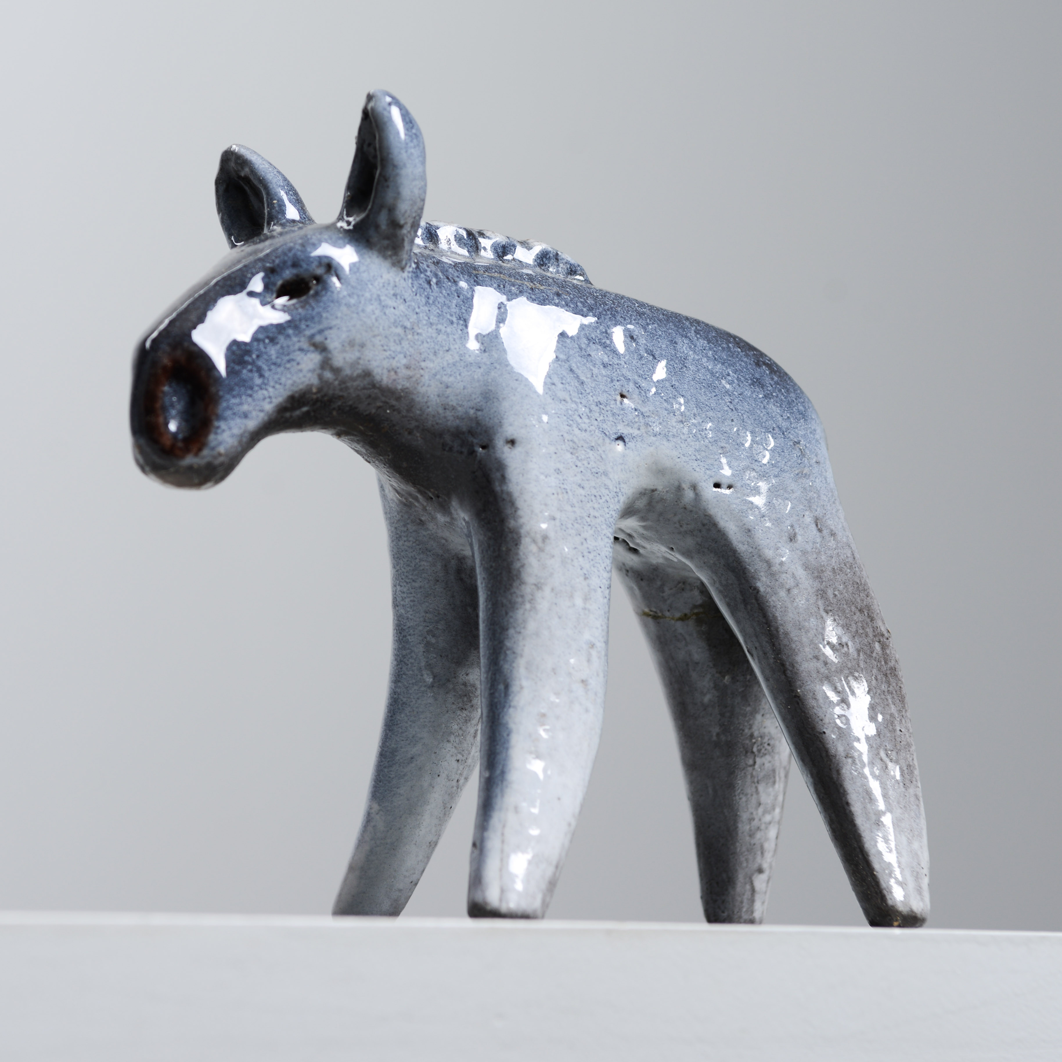 TAISTO KAASINEN. Figurin, älgkalv, modell 6057, Upsala-Ekeby.