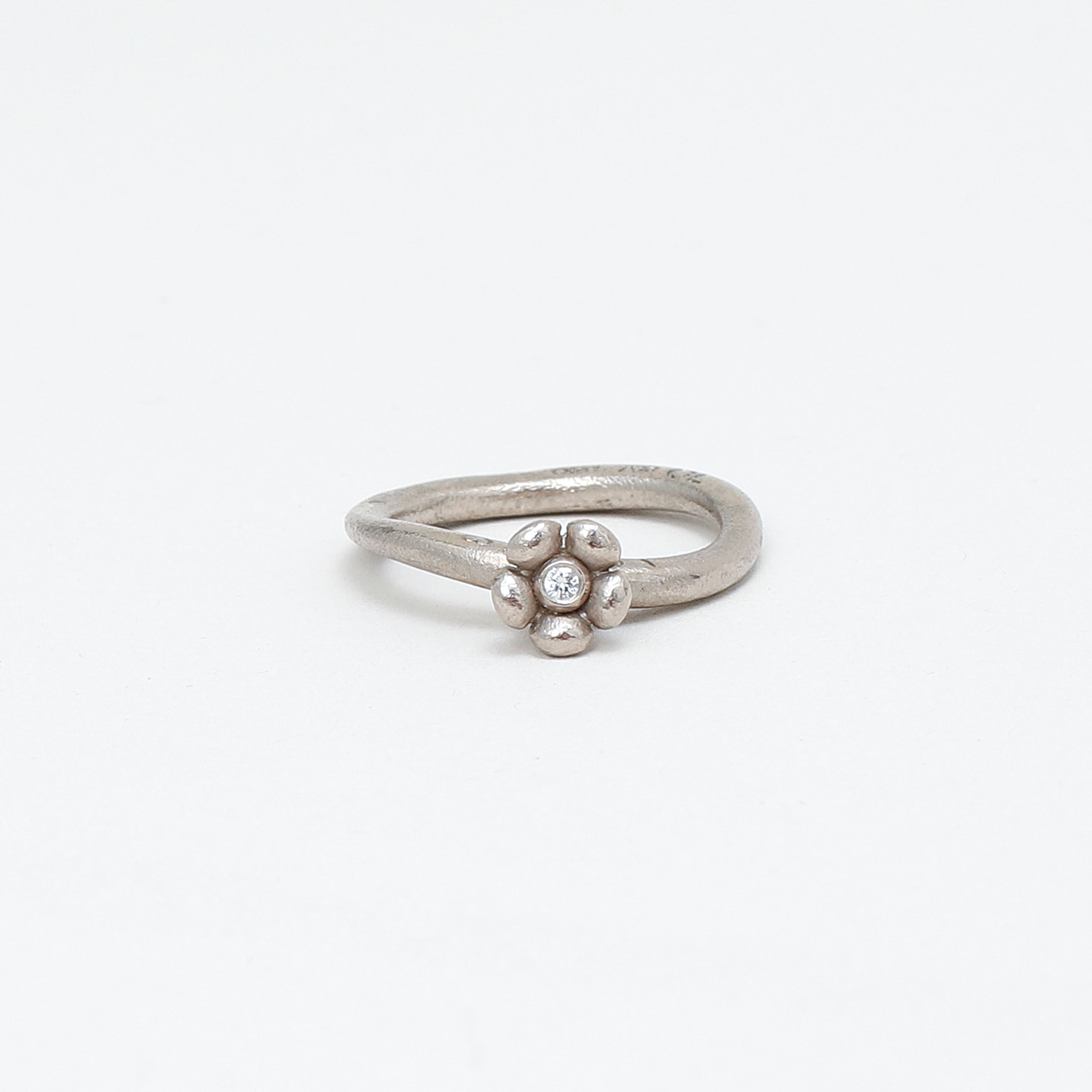 CHARLOTTE LYNGGAARD. Ring, "Love" 18k vitguld, diamant ca 0,03ct, Ole Lynggaard.
