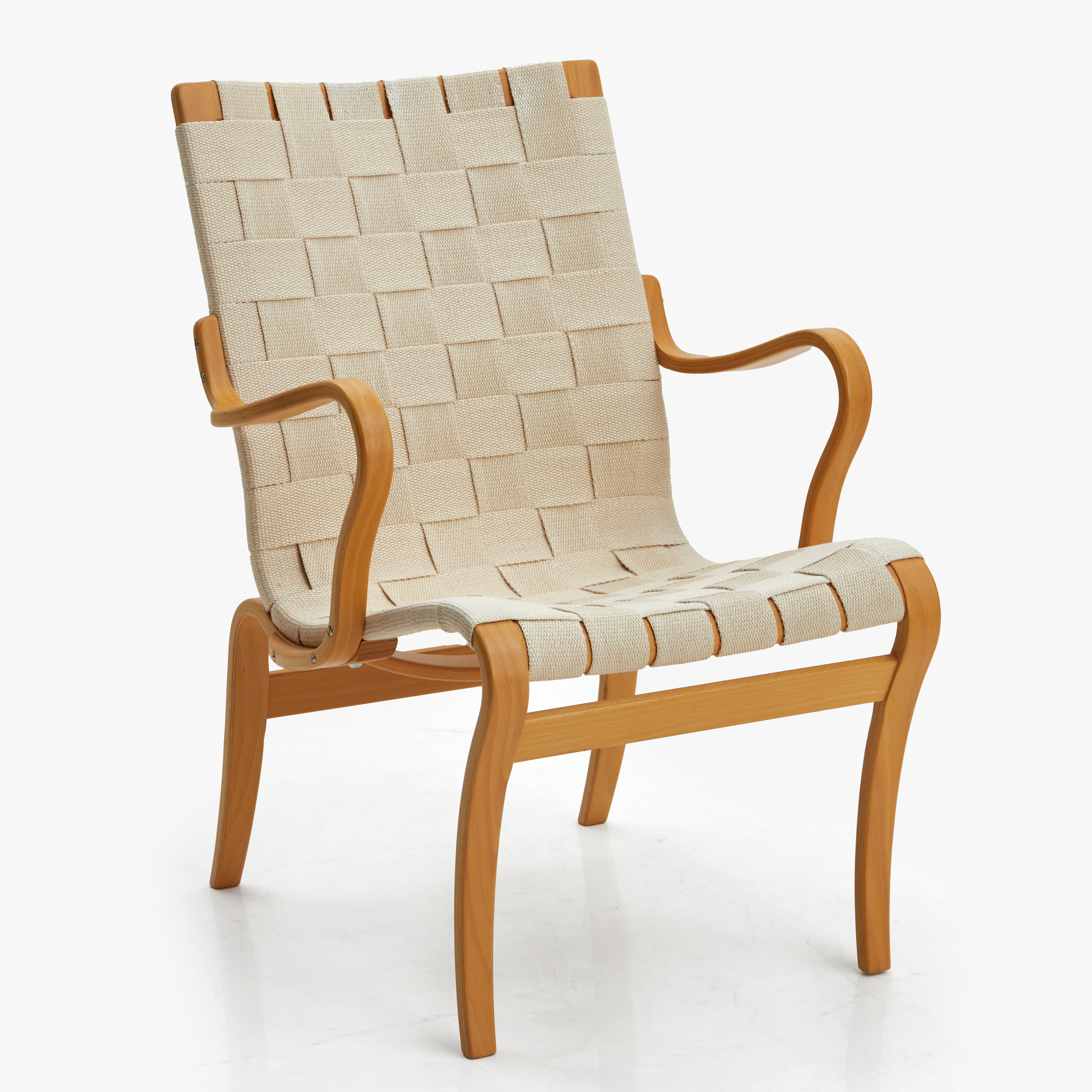 BRUNO MATHSSON (1907–1988). Fåtölj, modell "Mina", bok, klädsel i sadelgjord, brännmärkt med datering 1997.