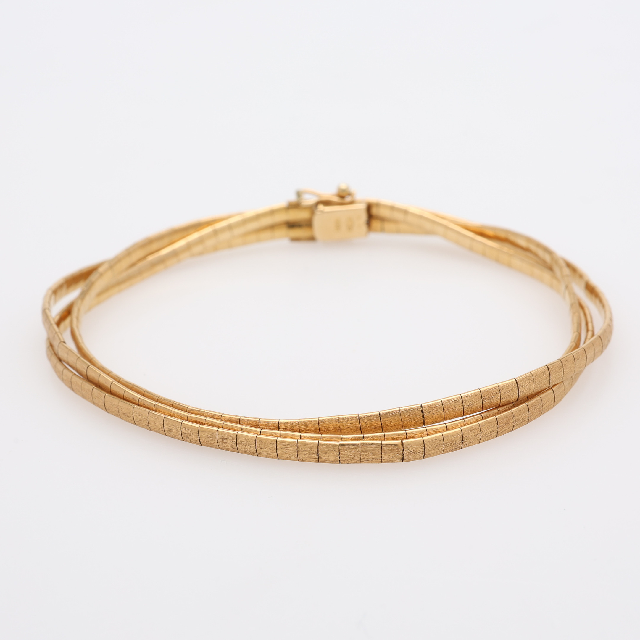 ARMBAND, TRE-RADIGT, 18K GULD, AREZZO, ITALIEN, VIKT 18,3 GRAM.