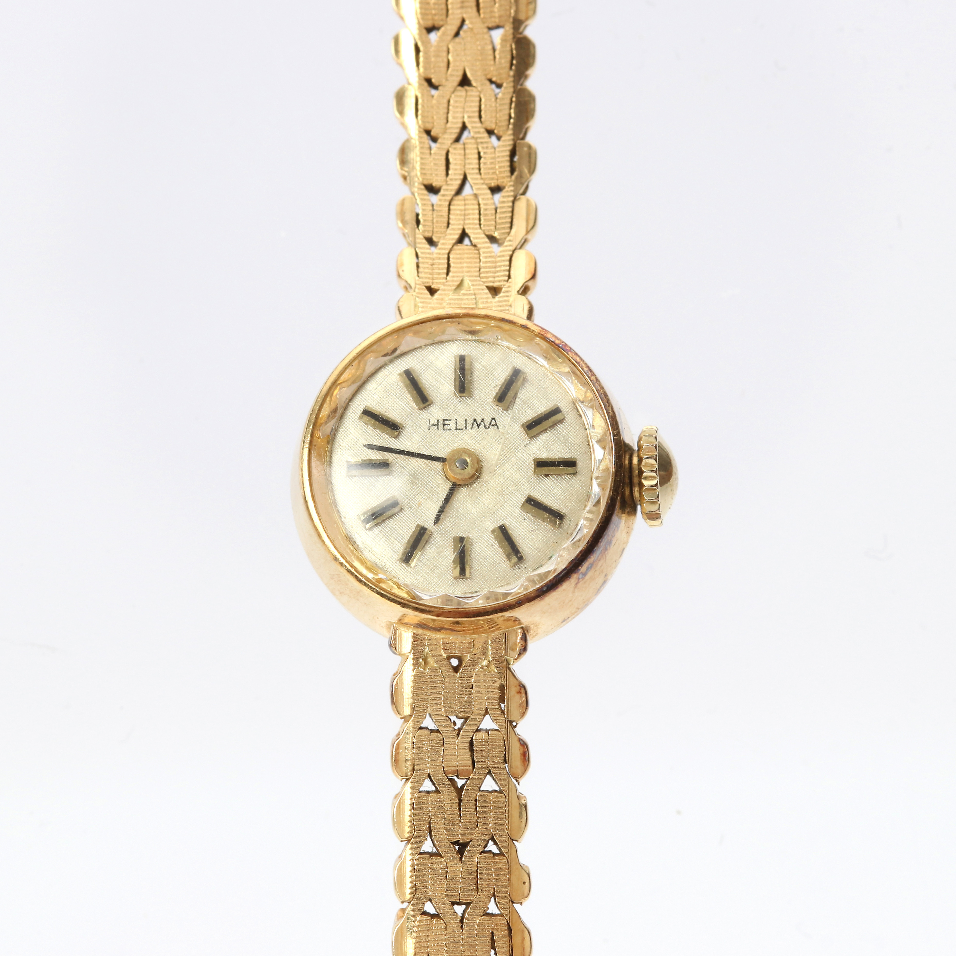 HELIMA, DAMARMBANDSUR. Boett och länk i 18k guld, totalvikt ca 21,8 gram.